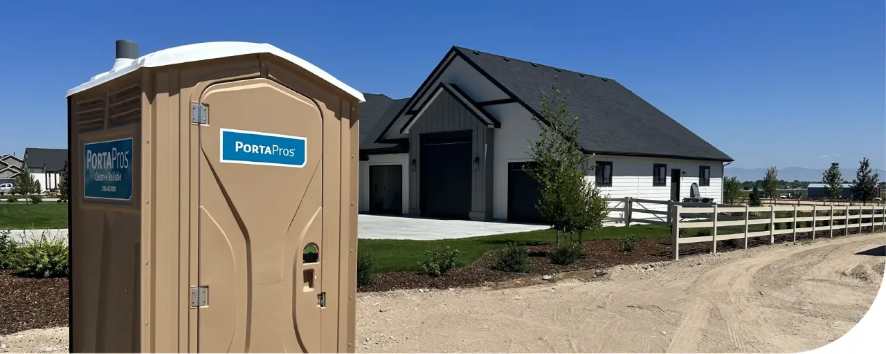 Porta potty rental unit staged for delivery in a Richmond, VA neighborhood